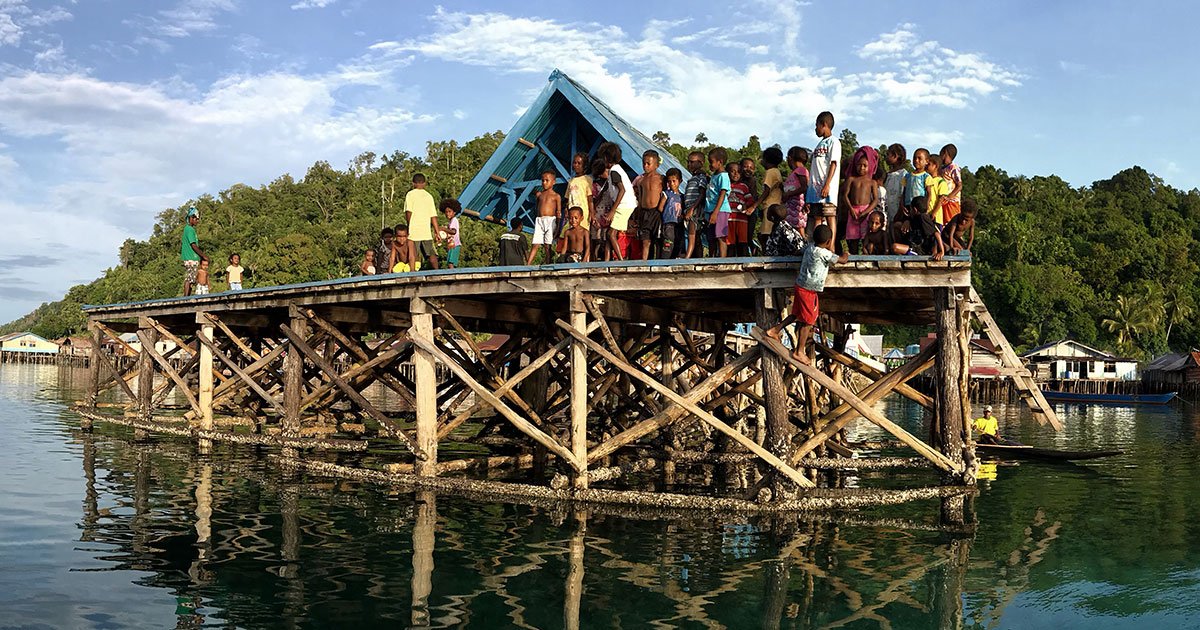 Villagers on a jetty, Indonesia